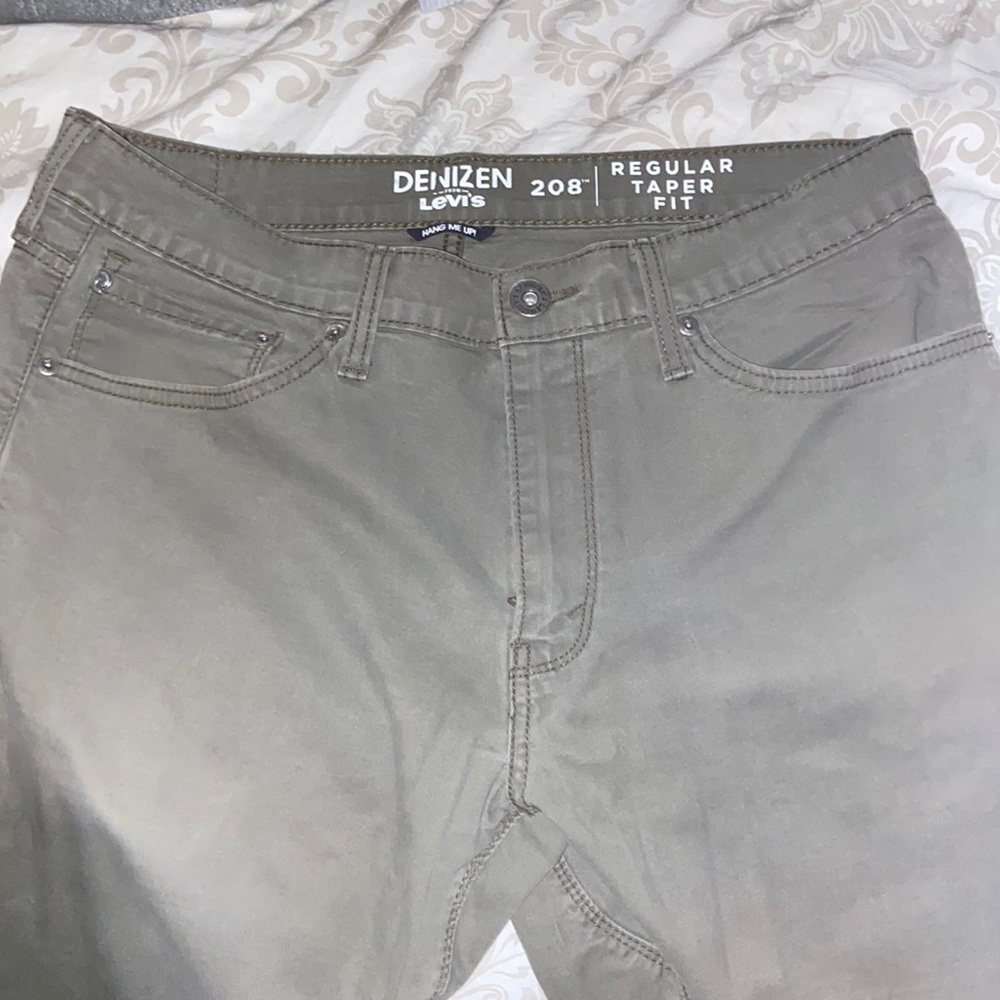 Olive green regular taper fit pants from Levi.